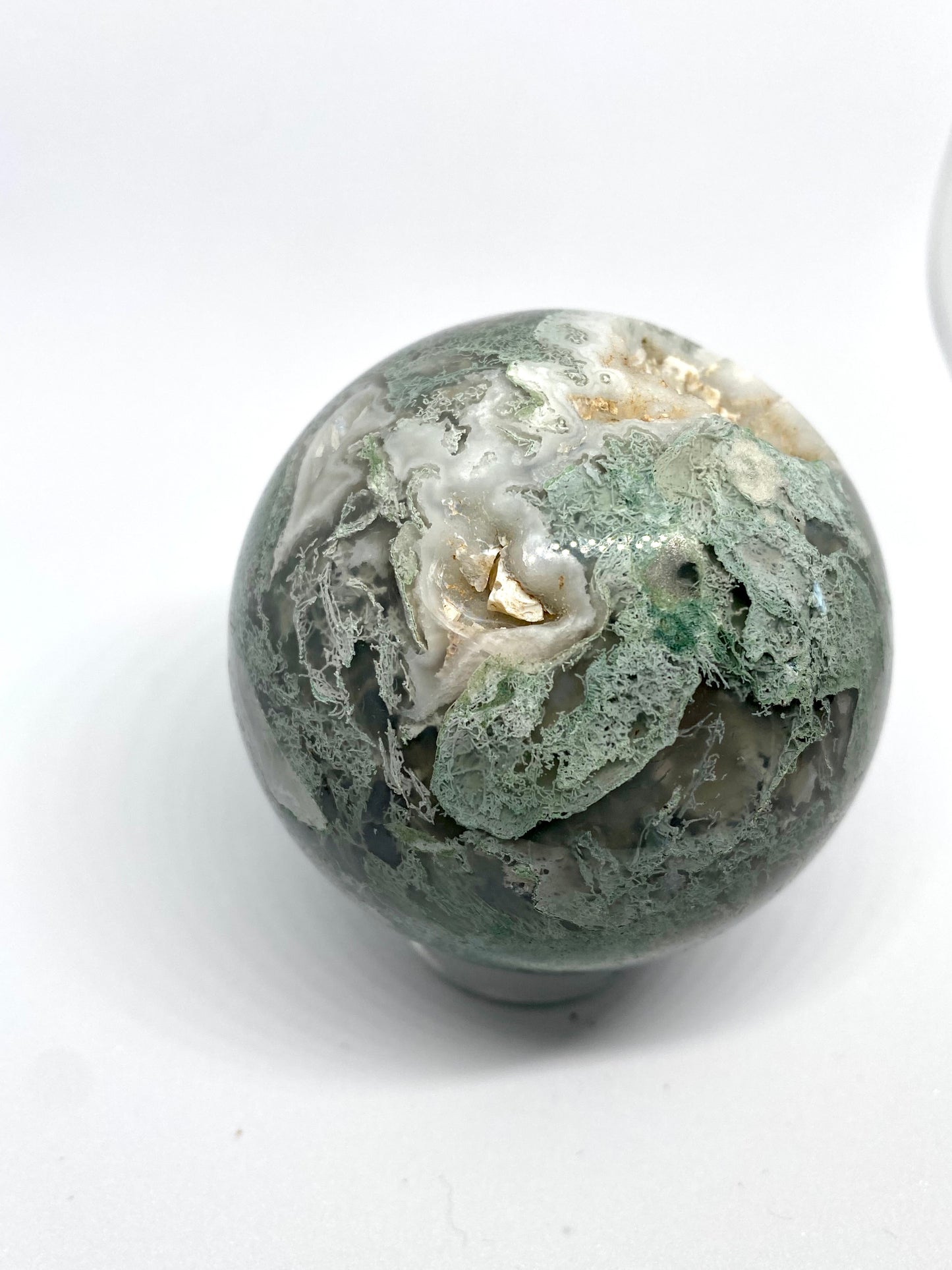 Moss agate sphere with druzy