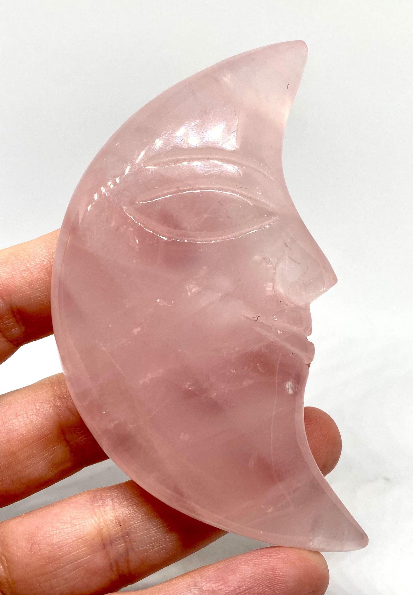 Rose quartz moon carving