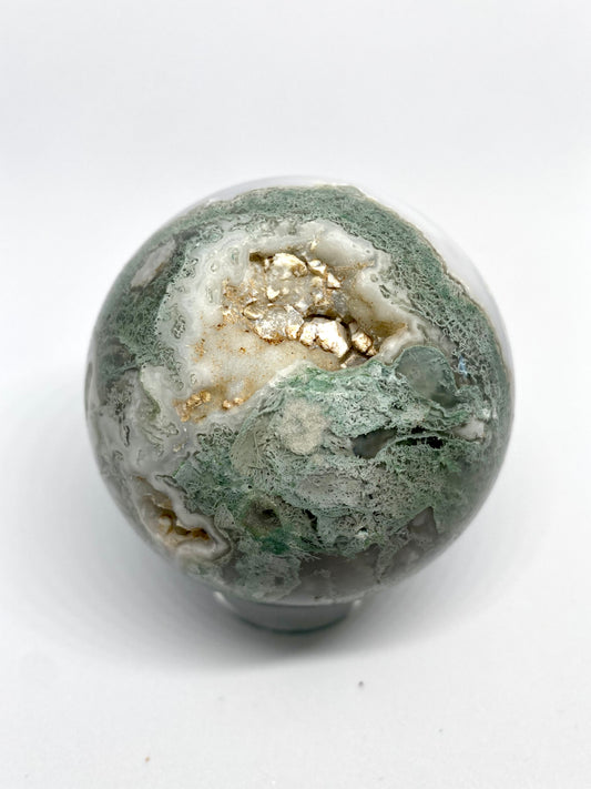 Moss agate sphere with druzy